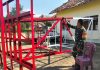 Asa Menata di Isorejo, Babinsa Serda Abdul Rohman Cat menara sumur bor setinggi 5 meter
